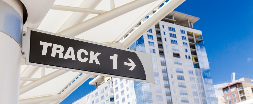 A closeup of the Track one sign at an train station operated by the Regional Transportation District. 