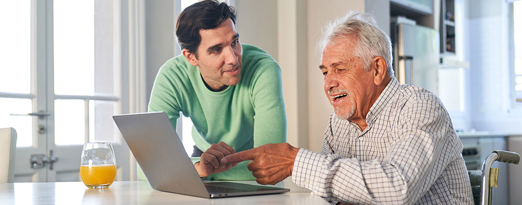 Older adult man with grandson. 