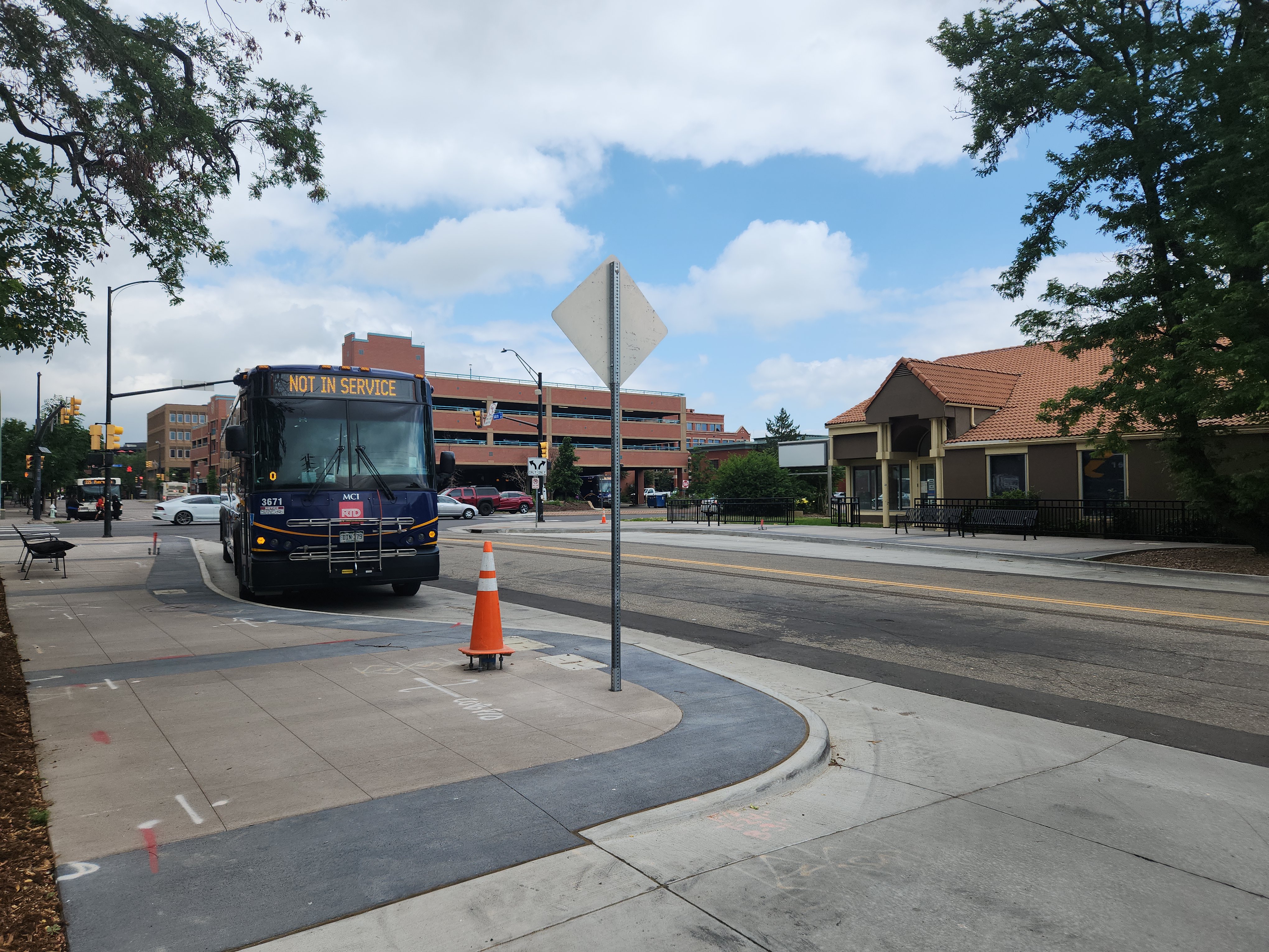 A public bus paked on a city street.