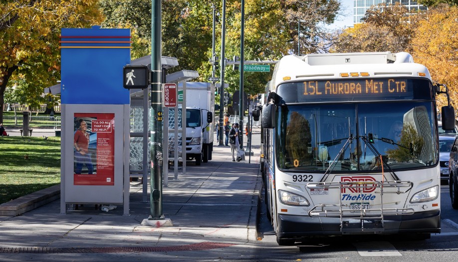 The Regional Transportation District 15L bus waits for a traffic light to change.