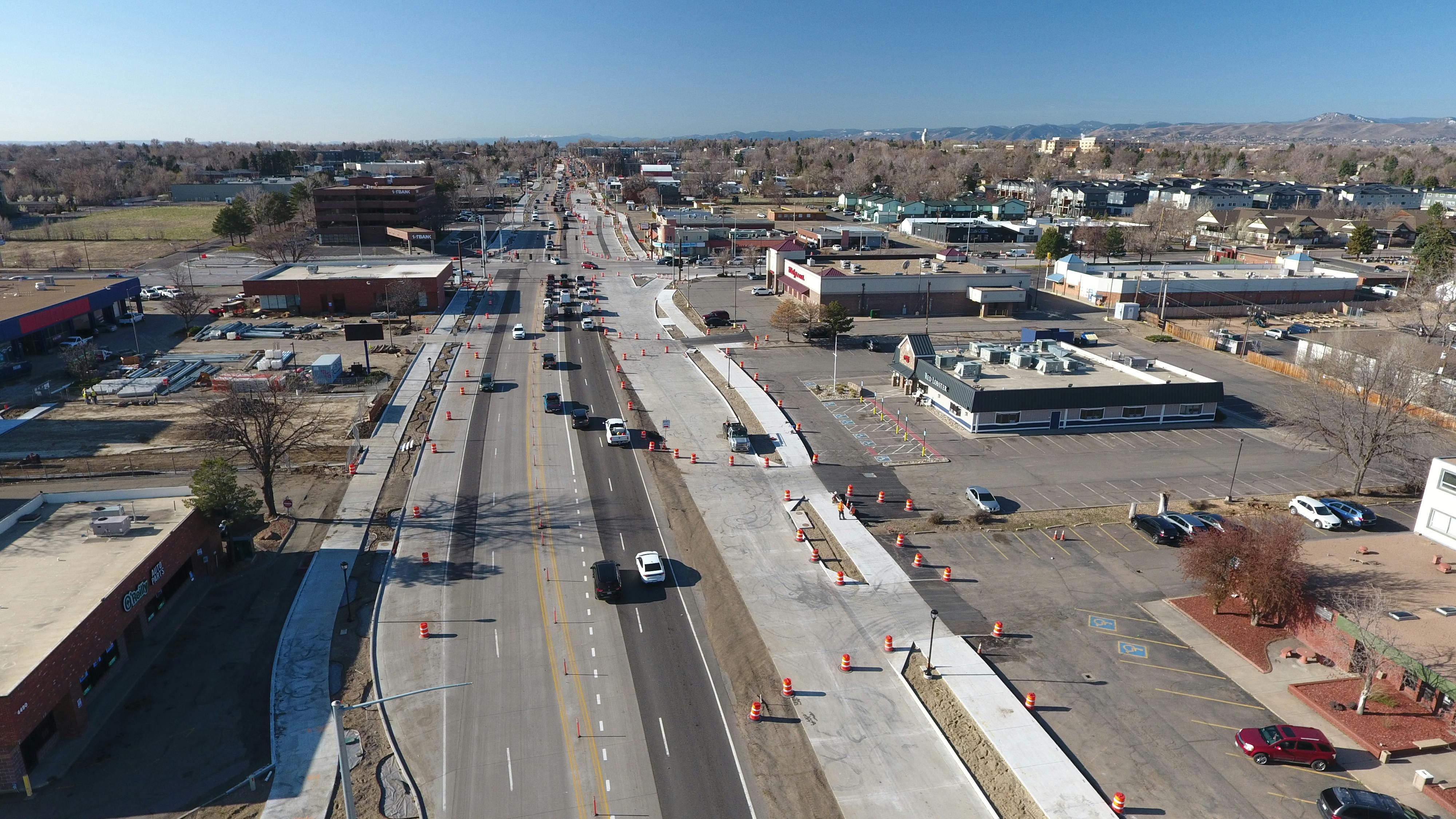 An aerial view of Wadsworth Boulevard near 44th Avenue that shows new traffic lanes with orange cones sitting in them.