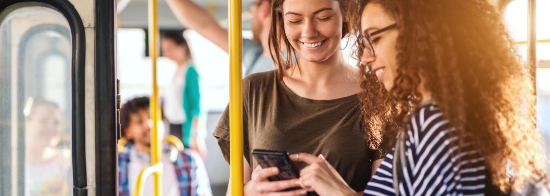 Two women riding a bus